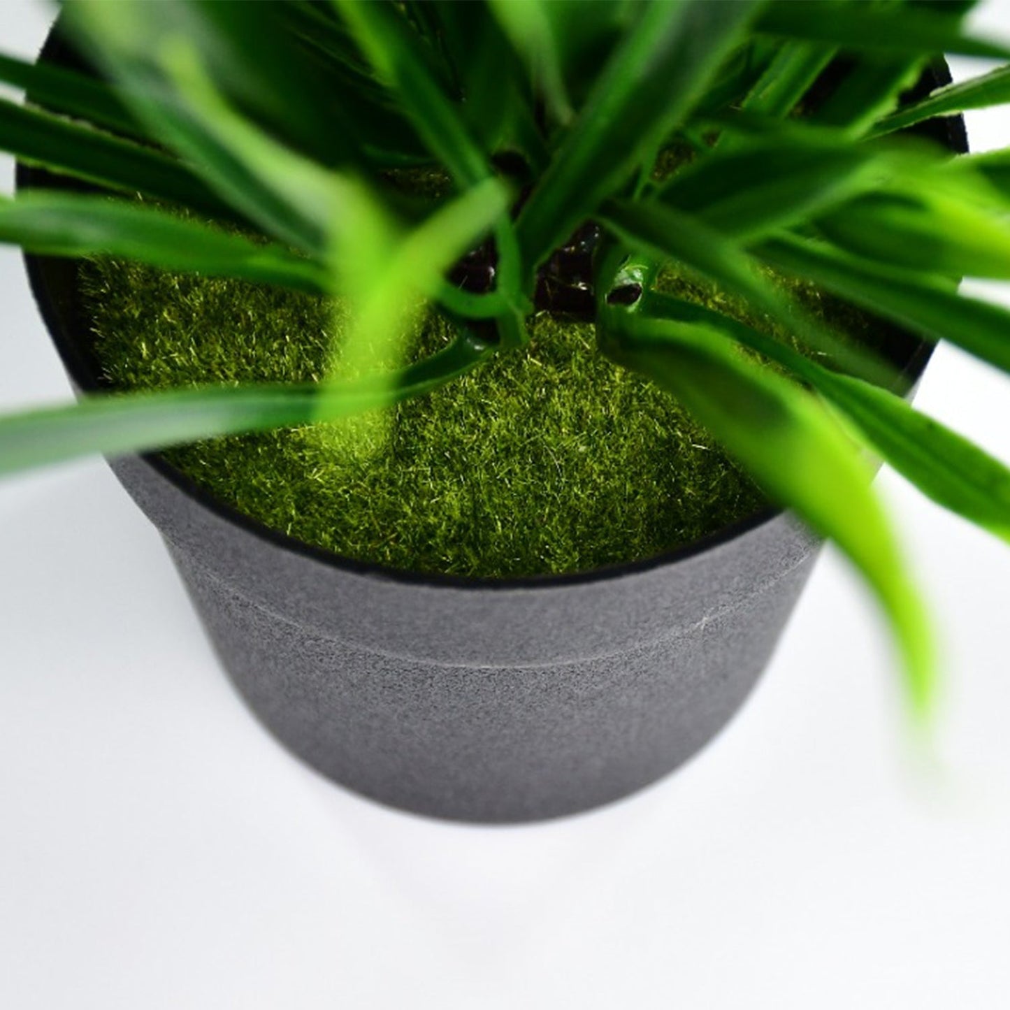 Artificial plant in a decorative pot for home decor.