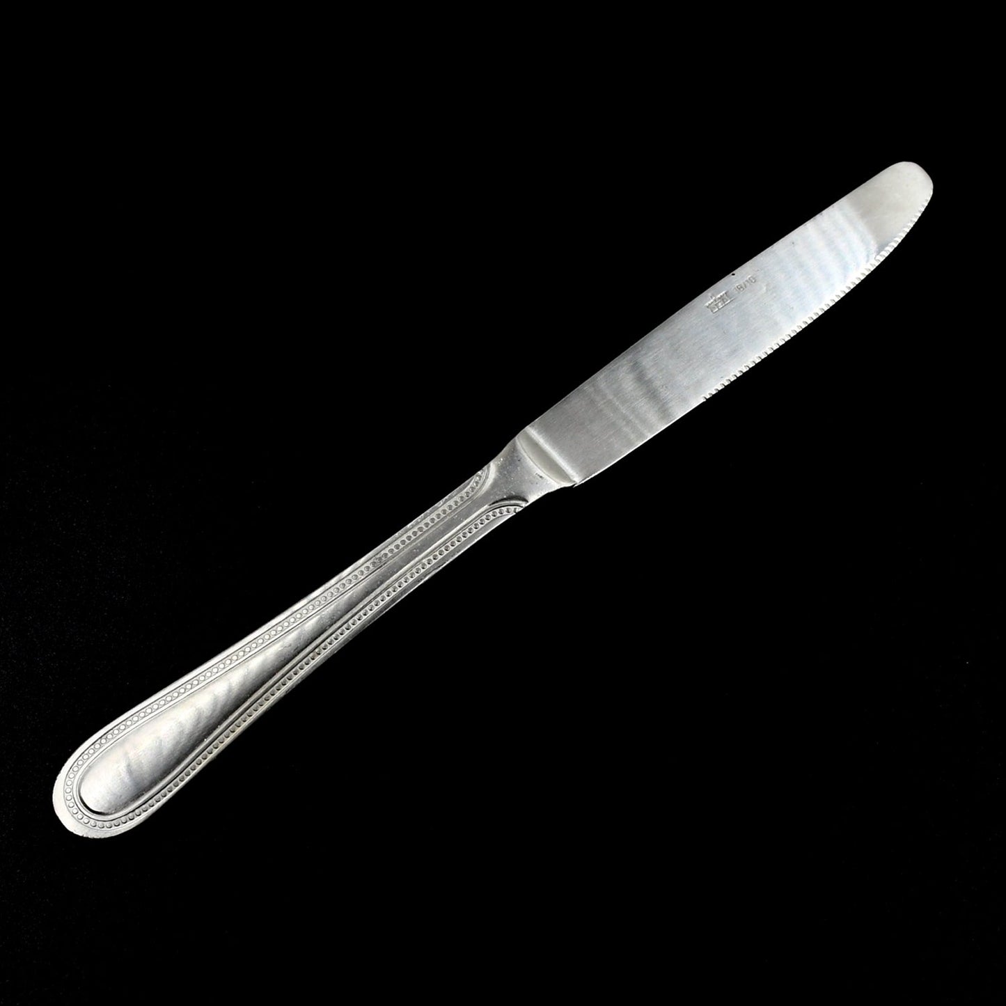 Steel handle kitchen knife with stainless steel blade, designed for durability.